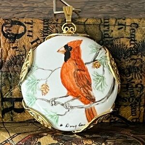 Hand-Painted Cardinal Pendant Necklace – 
Porcelain in Ornate Gold-Tone Filigree